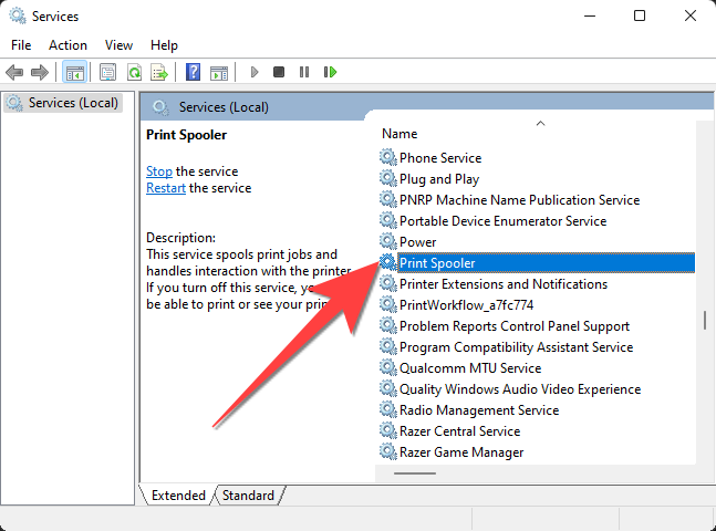 Scroll down in the Services panel and double-click on "Print Spooler."