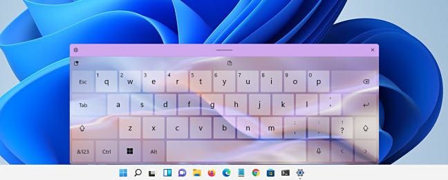 A Windows 11 touch keyboard with a theme applied.