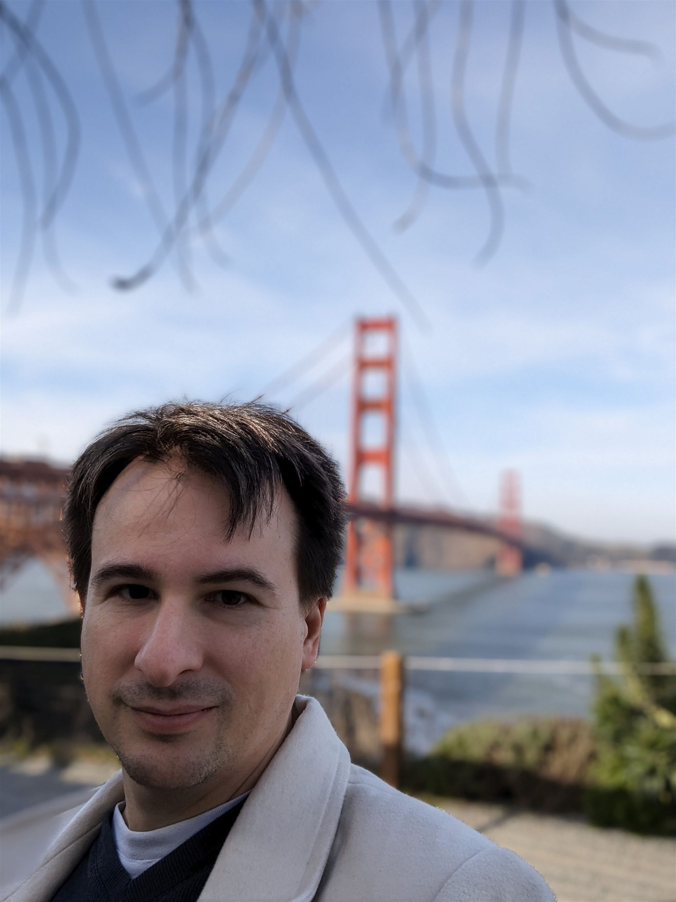 A man in front of the Golden Gate Bridge