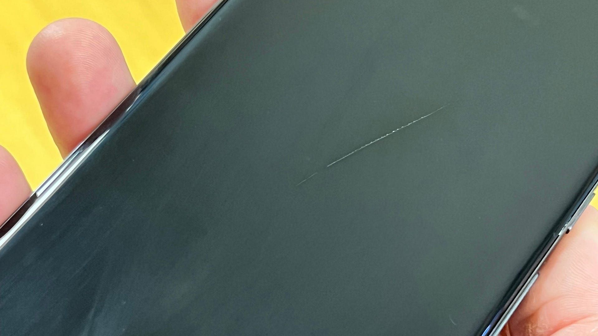 A deeply scratched phone display