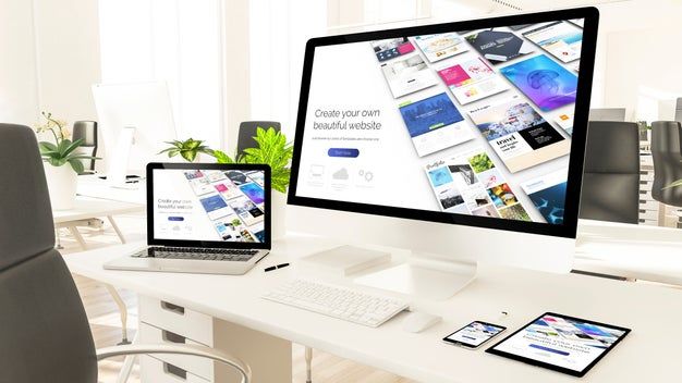 Web design displayed on multiple devices in office.